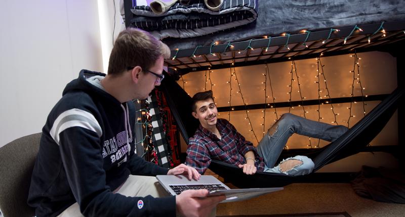 Students hanging out in their dorm room